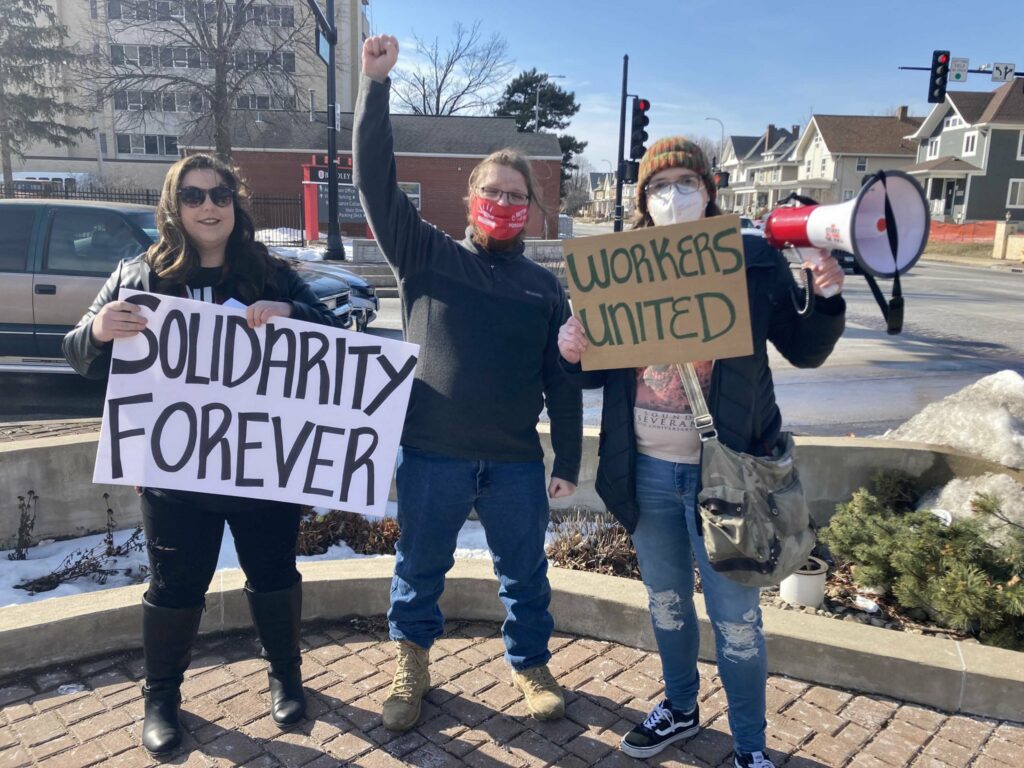 Picketers outside of a restaurant